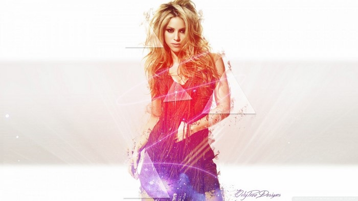 Shakira in a red fringed dress with abstract graphics