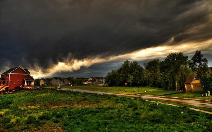 Stormy sky over a suburban landscape with houses