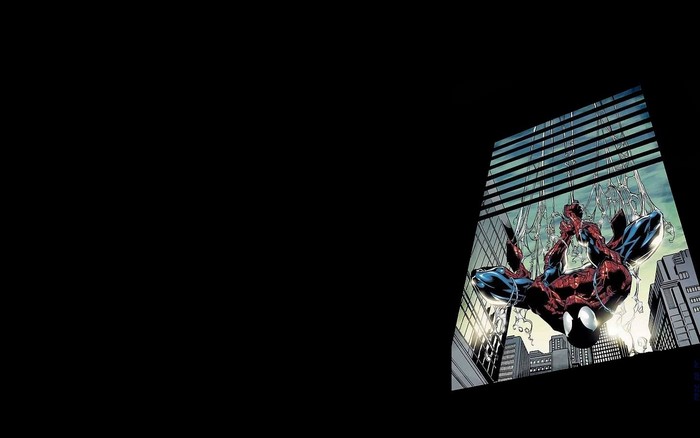 Spider-Man hanging from webs on a building