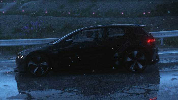 Black Audi sports car driving in the rain