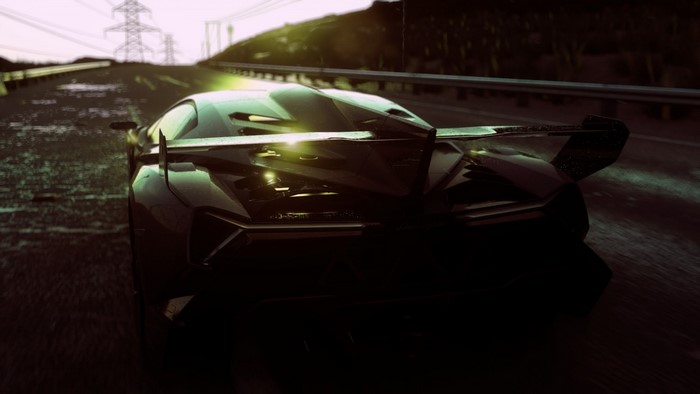 Lamborghini Aventador driving on a wet road at dusk