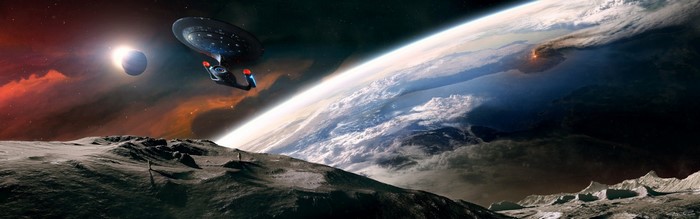 Starship Enterprise above a volcanic planet