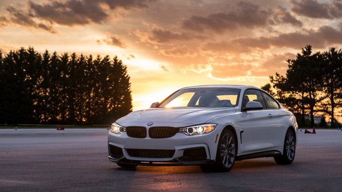 White BMW 4 Series Coupe at Sunset