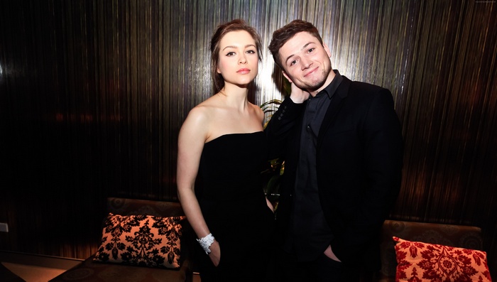 Sophie Cookson and Taron Egerton posing