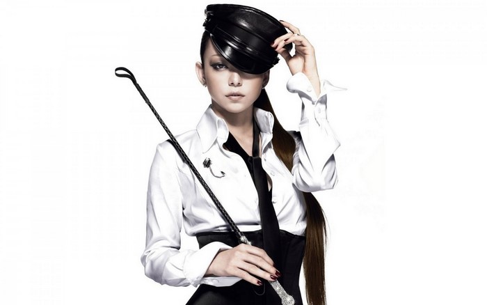Namie Amuro wearing a black cap and white shirt
