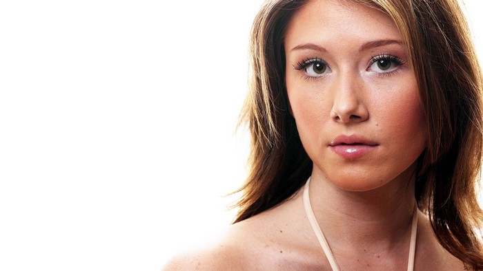 Jewel Staite portrait with brown hair and makeup