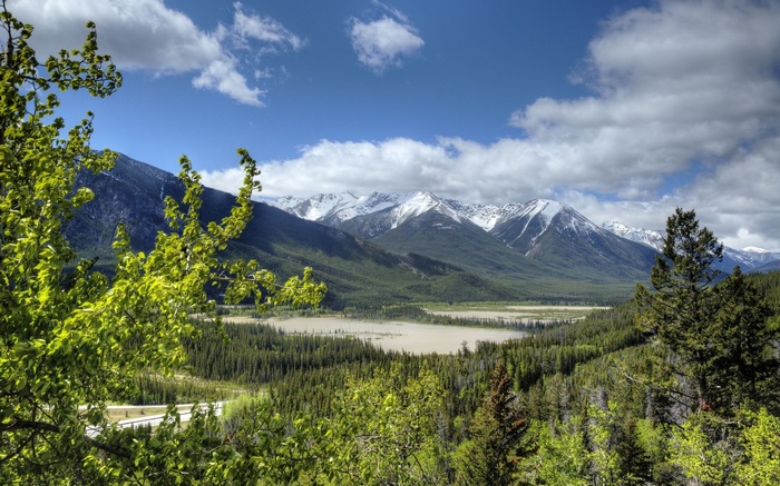 Mountain range with snow-capped peaks and a valley