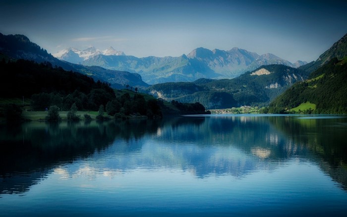 Lake reflection of mountains and valley