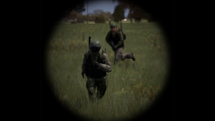 Soldiers in a field viewed through a scope