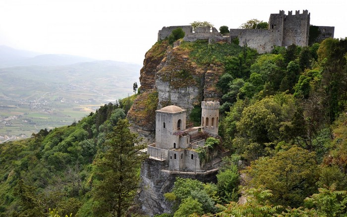 Castle on a cliff overlooking a valley