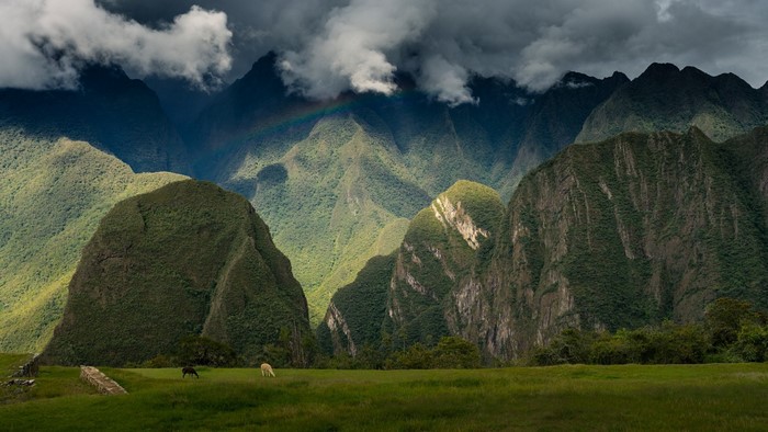 Misty Andes Mountains with Rainbow in Peru