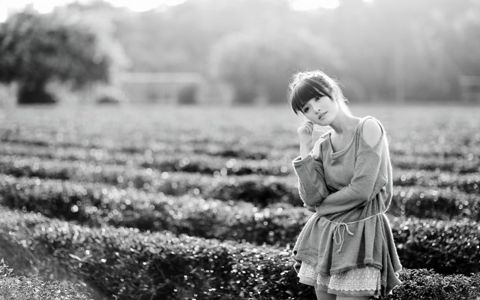 Woman posing in a field of plants