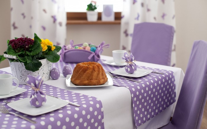 Easter table setting with cake and flowers