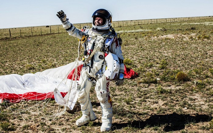 Felix Baumgartner in Red Bull Stratos suit with parachute