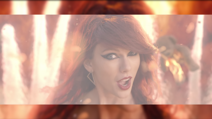 Taylor Swift with red hair and dramatic makeup