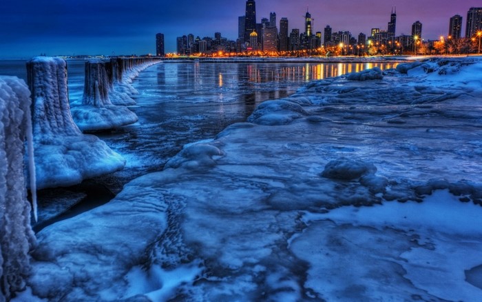 Chicago cityscape at dusk with frozen lakefront