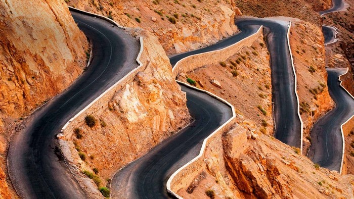 Winding mountain road carved into rocky terrain