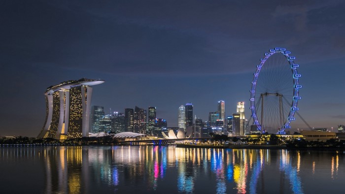 Singapore cityscape at night with Marina Bay Sands and Singapore Flyer