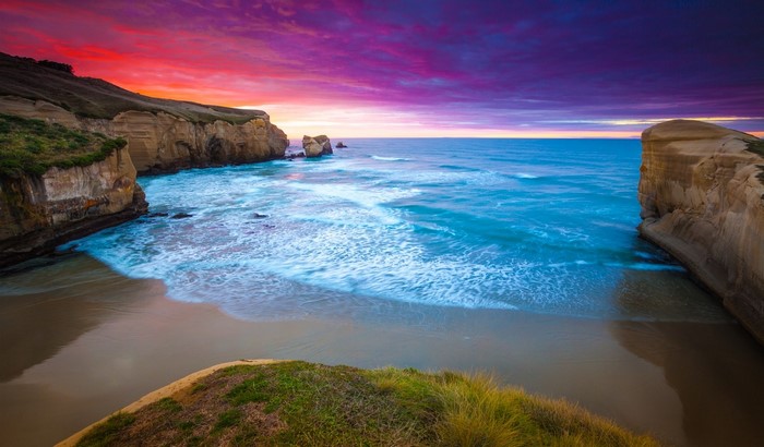 Coastal cliffs and ocean at sunset