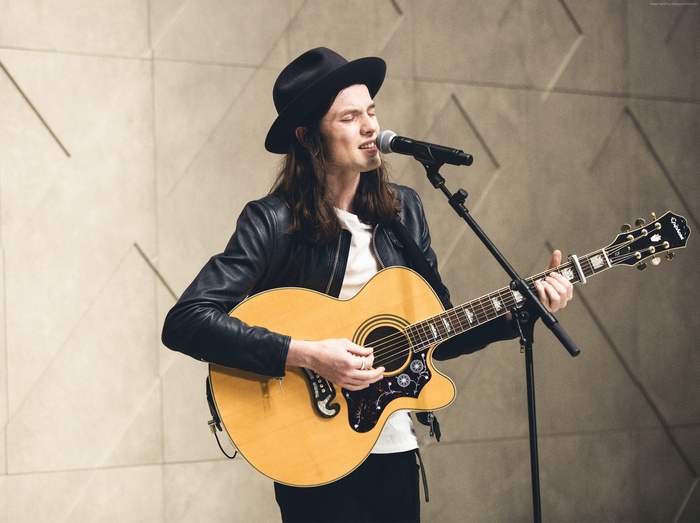 James Bay performing with acoustic guitar