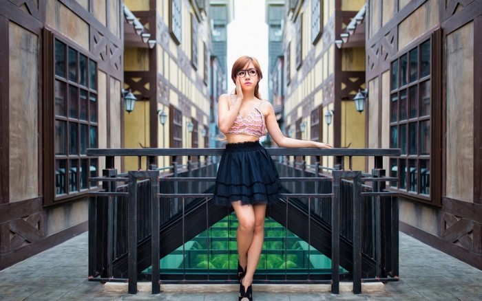 Woman in Glasses Wearing Black Skirt and Pink Top