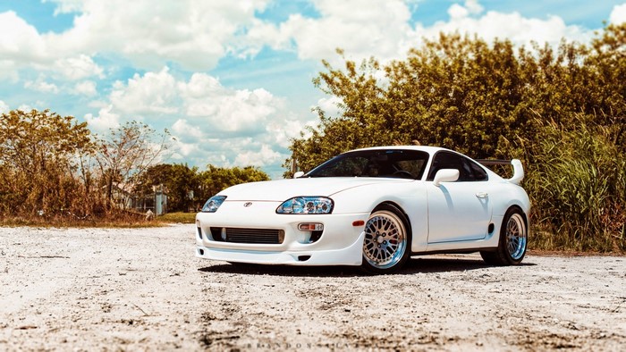 White Toyota Supra parked on a dirt road