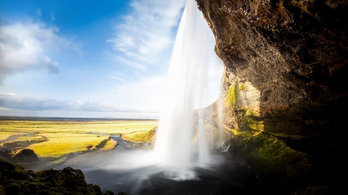 Seljalandsfoss waterfall in Iceland with green landscape