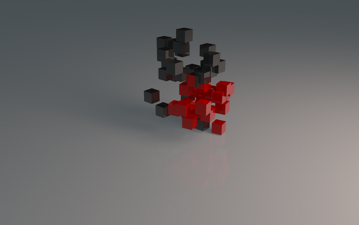 Red and black cubes scattered on a reflective surface
