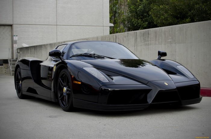 Black Ferrari Enzo supercar parked outdoors