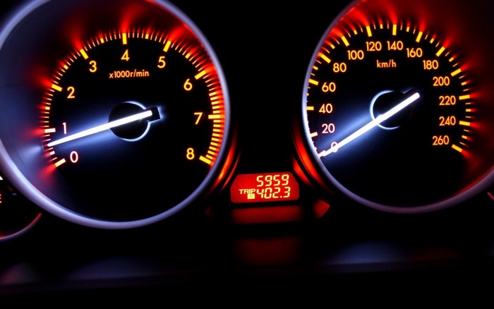 Car dashboard with tachometer and speedometer
