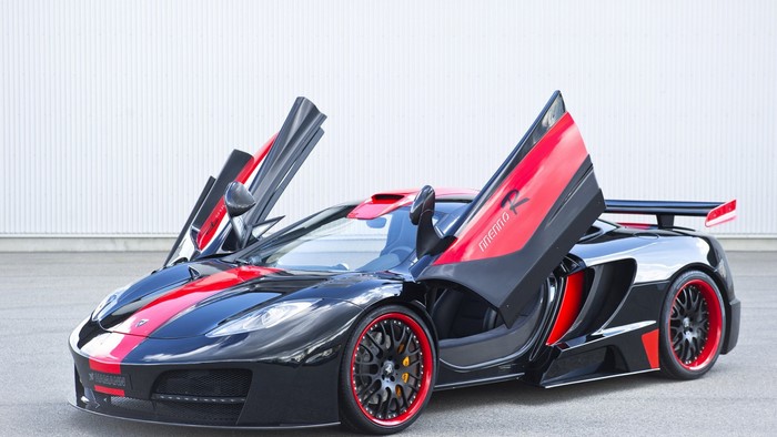 Black McLaren MP4-12C with red accents and butterfly doors