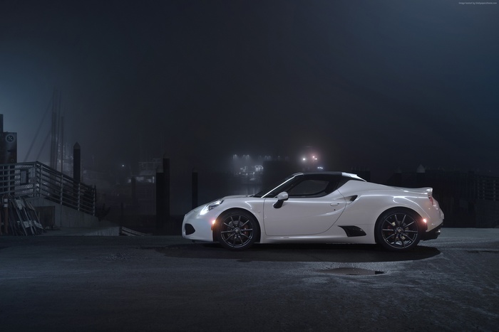 White Alfa Romeo 4C Coupe parked at night
