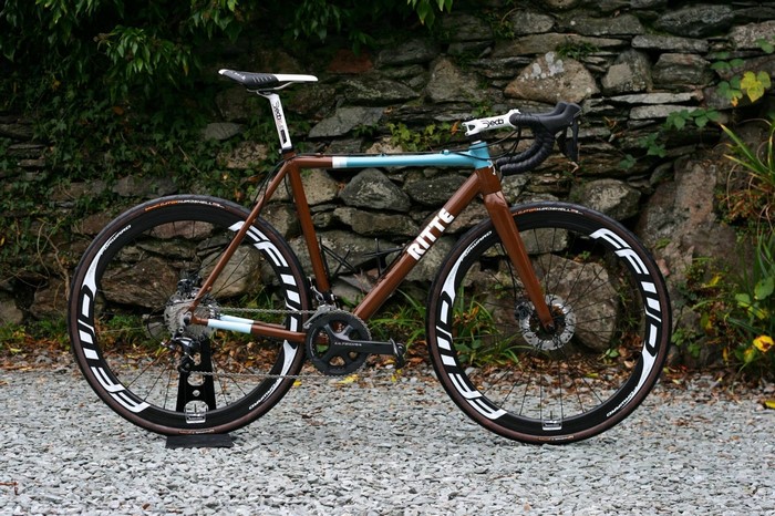 Ritte brown and teal road bicycle on stand