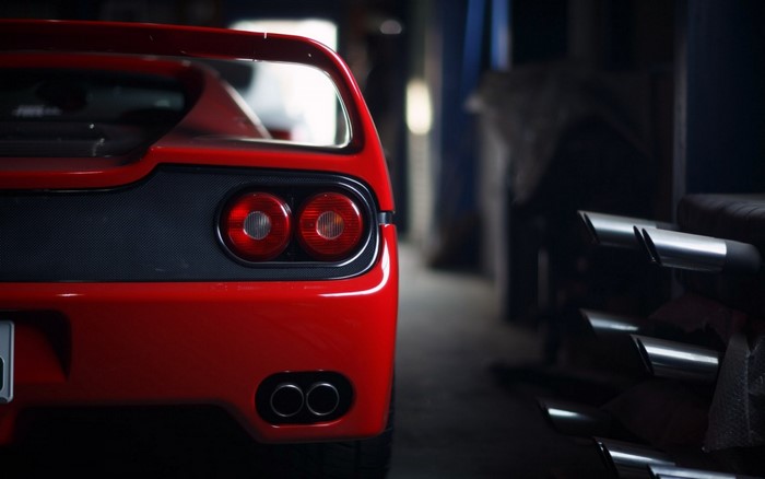 Red Ferrari F50 sports car rear view