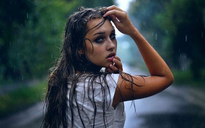 Woman with wet hair in the rain