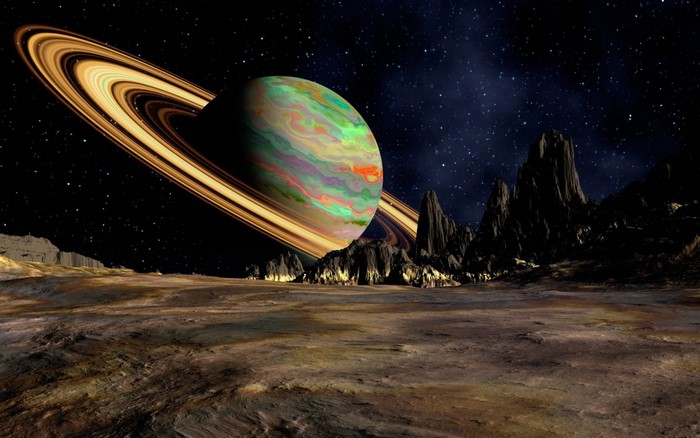 Alien planet with rings and rocky terrain