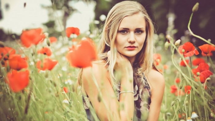 Woman in a field of poppies