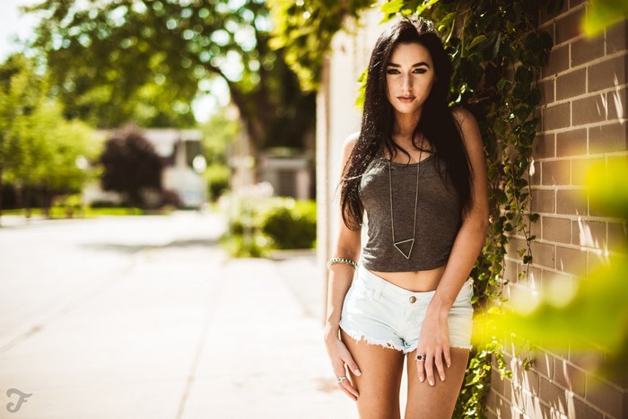 Model Jacqlyn B in jean shorts and tank top