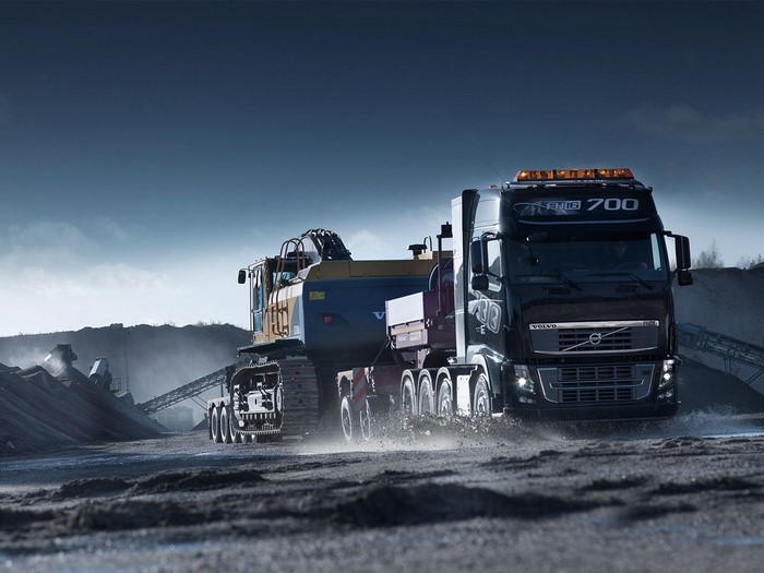 Volvo FH16 700 truck transporting excavator