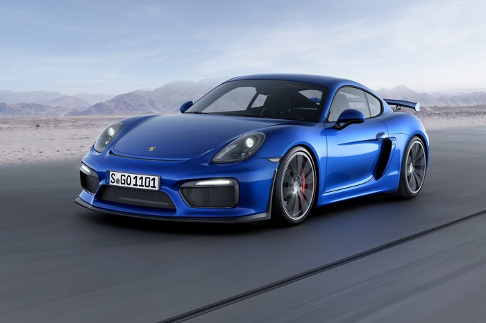 Blue Porsche Cayman GT4 on a track