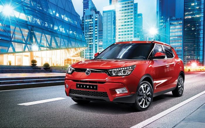 Red SsangYong Tivoli crossover in a city