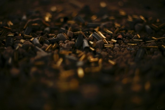 Close up of shell casings on the ground