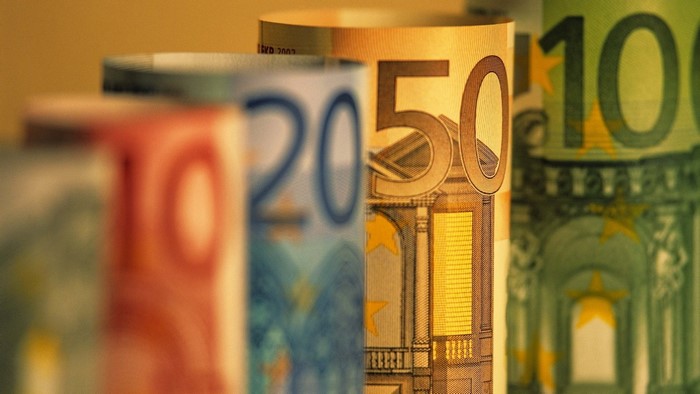 Rolled Euro banknotes: 20, 50, and 100