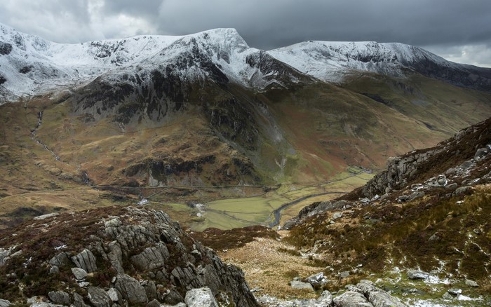 Snow-capped mountains and a valley landscape