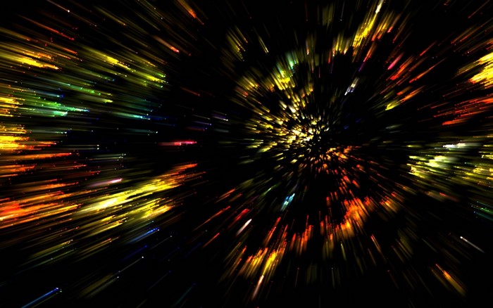 Abstract explosion of colorful light streaks in darkness