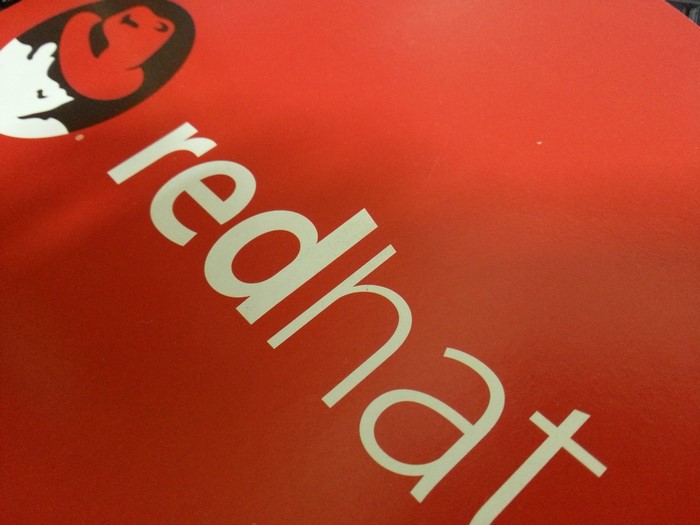 Red Hat logo and text on red background