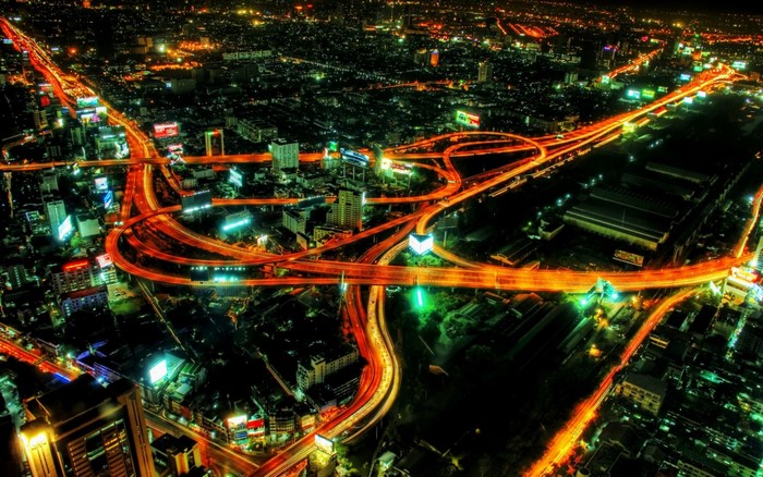 Aerial view of a city highway interchange at night