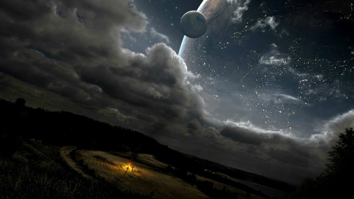 Night sky with planets and clouds over a field with a campfire