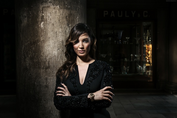 Berenice Marlohe posing in front of Pauly & C.