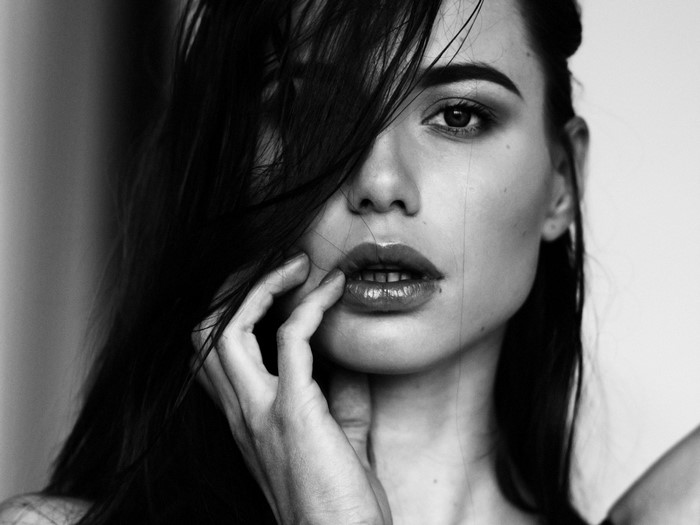 Monochrome portrait of a woman with dark hair